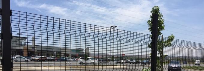 Black polyester coated Medium Security clearvu fence for parking lot protection.