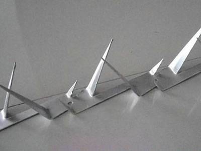 A line of wall galvanized wall spike on the ground.